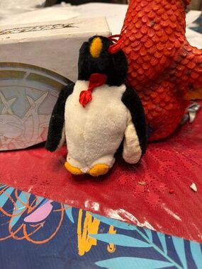 Plush vintage penguin plush toy, potentially a "Full O' Beans" Flapper the Peng